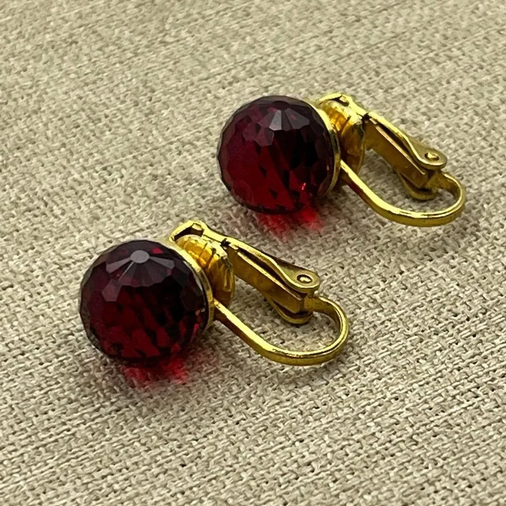 Vintage red glass multi faceted gold tone clip on earrings